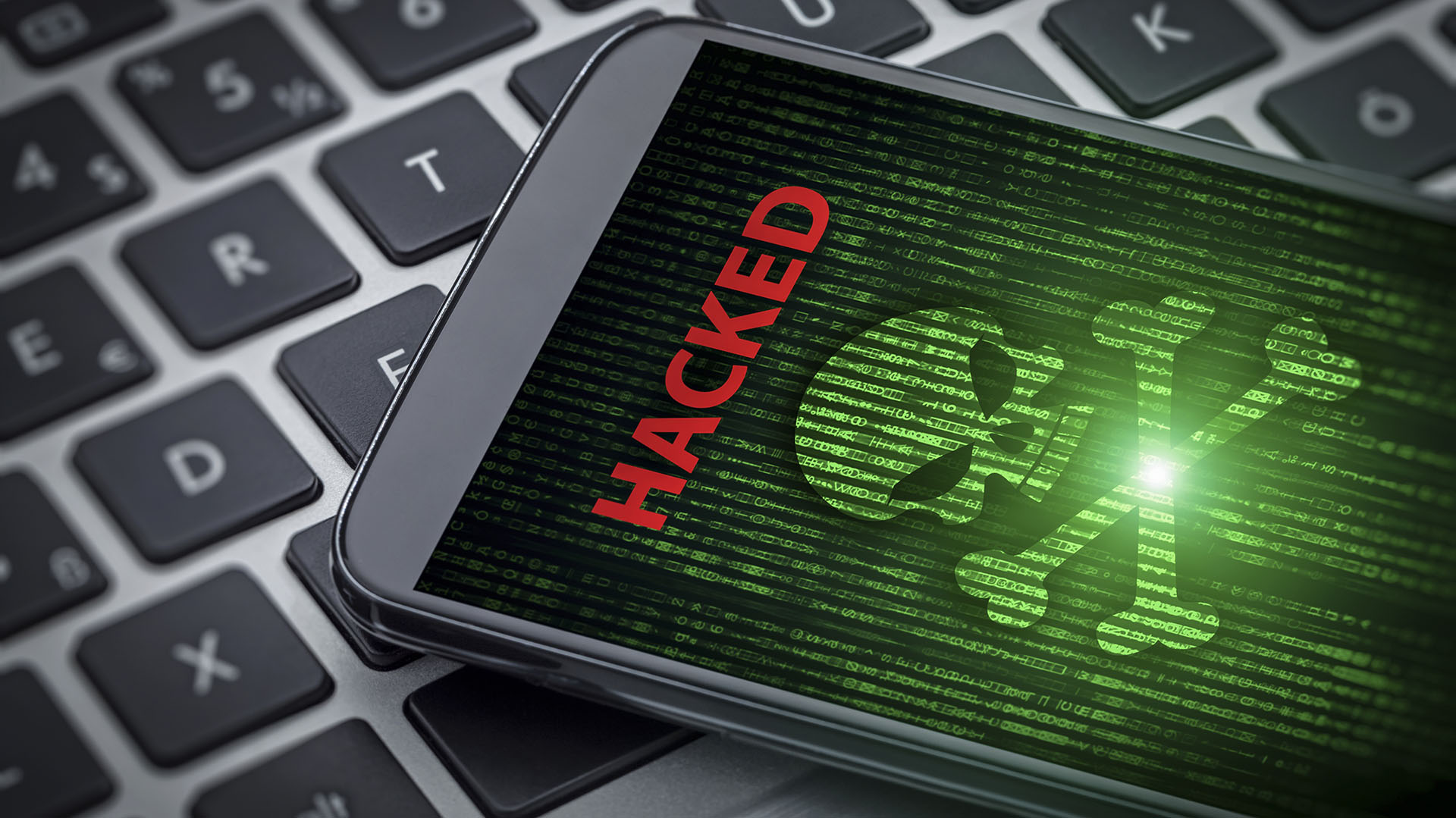 hacked message and skull of death on smartphone screen