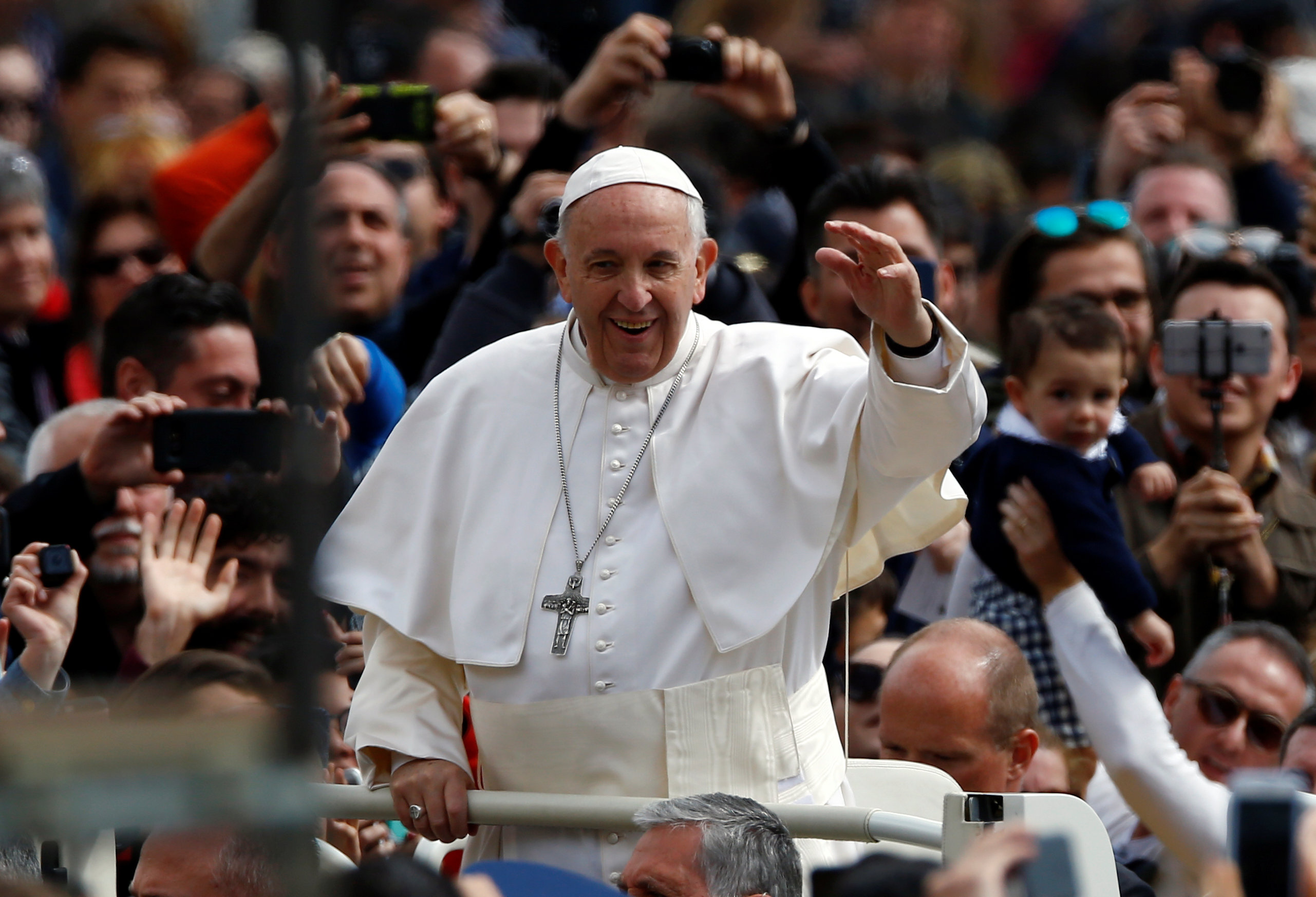 Pope Francis waves from his Papamobile after the Easter Mass at St. Peter's Square at the Vatican